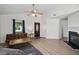 Bright living room featuring neutral walls, ceiling fan and view of entry door at 3808 Hopper St, Raleigh, NC 27616