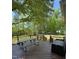 Inviting back deck with picnic table and storage, perfect for outdoor relaxation and enjoying the view at 404 Cary Pines Dr, Cary, NC 27513