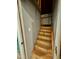 Wooden basement stairs with open railing, and an entry doorway at 404 Cary Pines Dr, Cary, NC 27513
