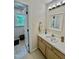 Bathroom with an extra door to another room with warm wooden cabinets and plenty of counter space at 404 Cary Pines Dr, Cary, NC 27513