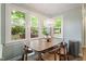 Dining area with large windows and a view of the backyard at 404 Cary Pines Dr, Cary, NC 27513