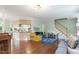 Spacious living room with hardwood floors, open layout, and a staircase leading to the upper level at 404 Cary Pines Dr, Cary, NC 27513