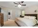 Spacious main bedroom featuring a ceiling fan, large closet and comfortable carpet at 404 Cary Pines Dr, Cary, NC 27513