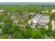 An aerial view of a neighborhood and lush green trees at 411 Flat Rail Trl, Cary, NC 27511