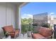 Relaxing outdoor balcony with seating and decorative screen at 411 Flat Rail Trl, Cary, NC 27511