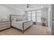 Comfortable bedroom with neutral colors, ceiling fan and plenty of natural light at 411 Flat Rail Trl, Cary, NC 27511