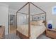 Bedroom featuring a four-post bed, neutral decor, and a striped rug at 411 Flat Rail Trl, Cary, NC 27511