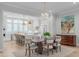 Stunning dining area adjacent to an open, light-filled kitchen, perfect for modern living at 411 Flat Rail Trl, Cary, NC 27511