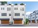 Townhome featuring two-car garage and rooftop patio at 411 Flat Rail Trl, Cary, NC 27511