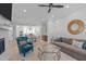 Spacious living room flowing into a dining area, featuring hardwood floors and modern decor at 411 Flat Rail Trl, Cary, NC 27511