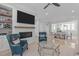 Elegant living room with a fireplace, hardwood floors, and seamless transition to the dining area at 411 Flat Rail Trl, Cary, NC 27511