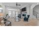 Inviting living room with a fireplace, hardwood floors, and comfortable seating area at 411 Flat Rail Trl, Cary, NC 27511