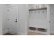 Bright mudroom featuring a storage bench and hooks at 411 Flat Rail Trl, Cary, NC 27511