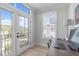 Bright office space with outside balcony, light wood floors, and plantation shutters at 411 Flat Rail Trl, Cary, NC 27511