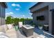 Rooftop deck with modern seating, a fire pit, and an outdoor television at 411 Flat Rail Trl, Cary, NC 27511