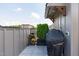 Cozy outdoor space with a grill, greenery, and gray plank flooring at 411 Flat Rail Trl, Cary, NC 27511