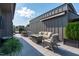 Inviting rooftop deck with comfortable seating, a fire pit, and sleek gray tiling at 411 Flat Rail Trl, Cary, NC 27511