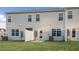 Exterior of the home with a gray siding, a fenced backyard and a lush green lawn at 412 Ember St, Sanford, NC 27330