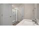 Well-lit bathroom featuring a walk-in shower and a vanity with a modern faucet and hardware at 412 Ember St, Sanford, NC 27330