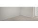 This bedroom features neutral carpeting, fresh paint, and a bright, sunny window at 412 Ember St, Sanford, NC 27330
