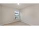 Cozy bedroom with neutral carpet, natural light from the window, and fresh paint throughout at 412 Ember St, Sanford, NC 27330