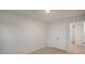 This bedroom includes a spacious closet with a door, neutral carpet, and a light, bright atmosphere at 412 Ember St, Sanford, NC 27330