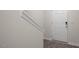 Bright entryway with hardwood floors, white door with digital lock and a staircase at 412 Ember St, Sanford, NC 27330