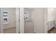 The hallway offers a view into the bedroom and the bathroom with dual sinks and white cabinets at 412 Ember St, Sanford, NC 27330