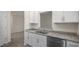 Kitchen area with granite countertops, stainless steel appliances and open space to other rooms at 412 Ember St, Sanford, NC 27330