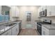 Modern kitchen with stainless steel appliances, granite countertops, and backyard access at 412 Ember St, Sanford, NC 27330