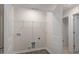 A tidy laundry room features hookups, neutral paint, and ample storage space at 412 Ember St, Sanford, NC 27330