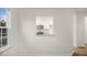 Bright living area with a pass-through view into a modern kitchen with white cabinetry at 412 Ember St, Sanford, NC 27330