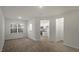 Spacious living room boasts hardwood floors and ample natural light from a large window at 412 Ember St, Sanford, NC 27330