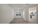 Bright room boasts hardwood floors and plenty of natural light, connecting seamlessly to the kitchen at 412 Ember St, Sanford, NC 27330