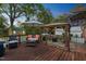 Inviting back deck with pergola, outdoor seating, and lush greenery at 418 S 2Nd St, Smithfield, NC 27577