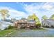 Well-maintained backyard featuring a deck, pergola, and fenced area at 418 S 2Nd St, Smithfield, NC 27577