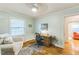 Bedroom features hardwood floors, a comfortable chair and lots of natural light at 418 S 2Nd St, Smithfield, NC 27577