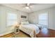 Bright bedroom features a ceiling fan, natural light and a decorative lamp at 418 S 2Nd St, Smithfield, NC 27577
