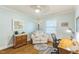 Cozy bedroom features light blue walls, hardwood floors, and a serene atmosphere at 418 S 2Nd St, Smithfield, NC 27577