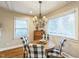 Cozy dining room featuring chandelier, window, and seating for four at 418 S 2Nd St, Smithfield, NC 27577