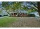Charming brick home with mature trees and well-maintained front yard at 418 S 2Nd St, Smithfield, NC 27577