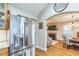 Stainless steel refrigerator offers lots of food storage next to a view of the living room and dining room at 418 S 2Nd St, Smithfield, NC 27577
