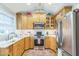 Well-equipped kitchen with stainless steel appliances, light wood cabinets and granite countertops offers plenty of space at 418 S 2Nd St, Smithfield, NC 27577