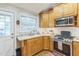 Bright kitchen features stainless steel appliances, granite countertops and a white subway tile backsplash at 418 S 2Nd St, Smithfield, NC 27577