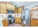 Bright kitchen features stainless steel appliances, light wood cabinets, and granite countertops at 418 S 2Nd St, Smithfield, NC 27577