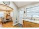 Kitchen with a view to the dining area, updated countertop, undermount sink and access to the back door at 418 S 2Nd St, Smithfield, NC 27577