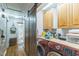 Bright laundry room with front load washer and dryer and a sliding barn door at 418 S 2Nd St, Smithfield, NC 27577