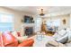 Cozy living room features a fireplace, hardwood floors, neutral tones, and a dining area with natural light at 418 S 2Nd St, Smithfield, NC 27577