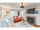 Comfortable living room with fireplace, hardwood floors, neutral tones, and ample space for relaxing at 418 S 2Nd St, Smithfield, NC 27577