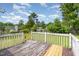 Spacious back deck with wooden railing overlooks the backyard and the green space at 43 Columbus Ct, Spring Lake, NC 28390